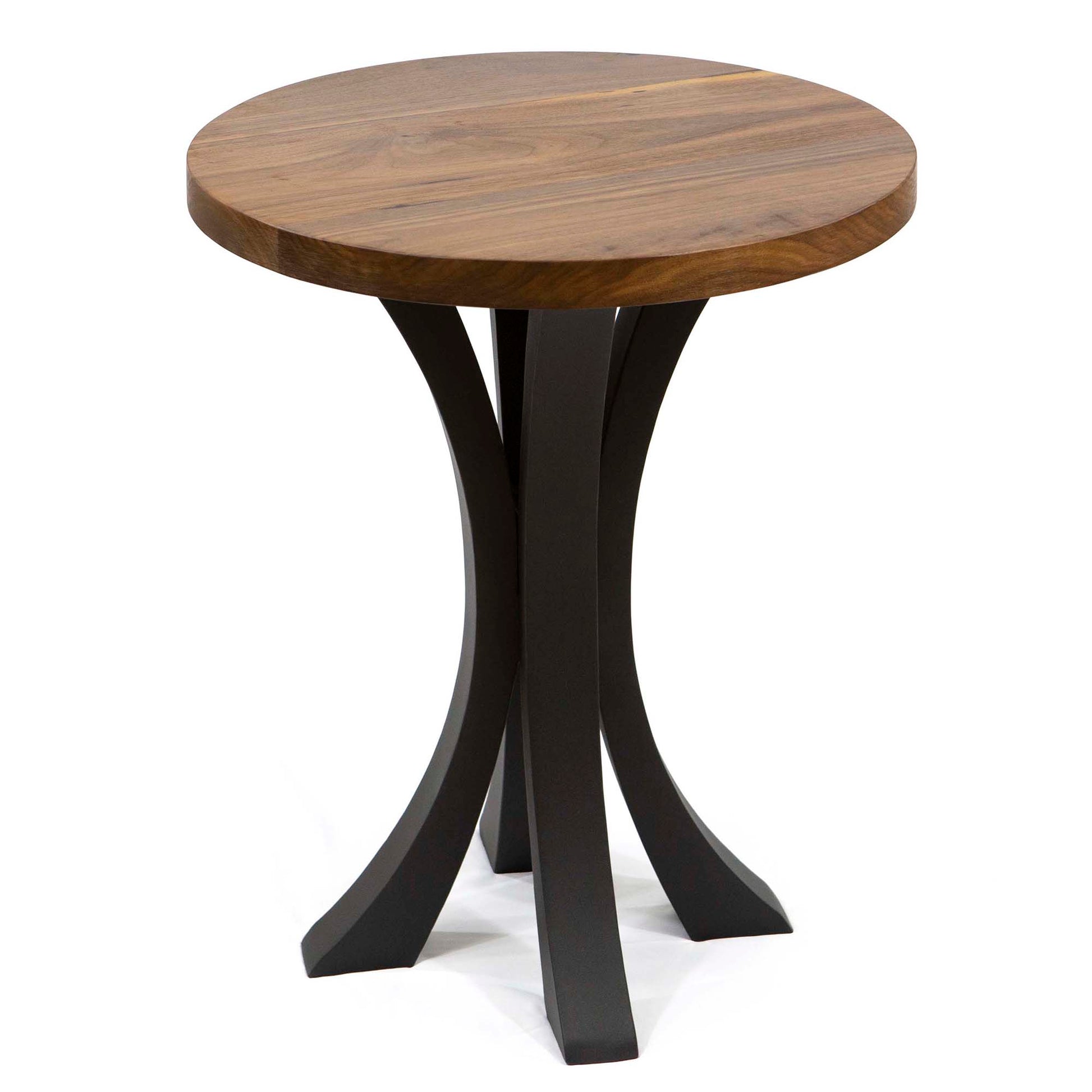 Round wooden side table with black metal legs on a white background