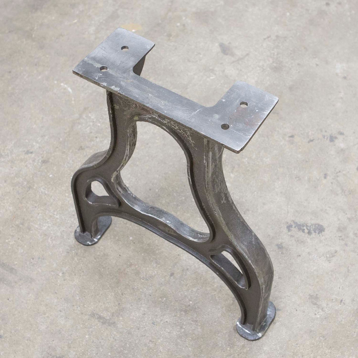 Top mounting plate of CAST11 cast iron table leg with pre-drilled holes for wood tabletop attachment