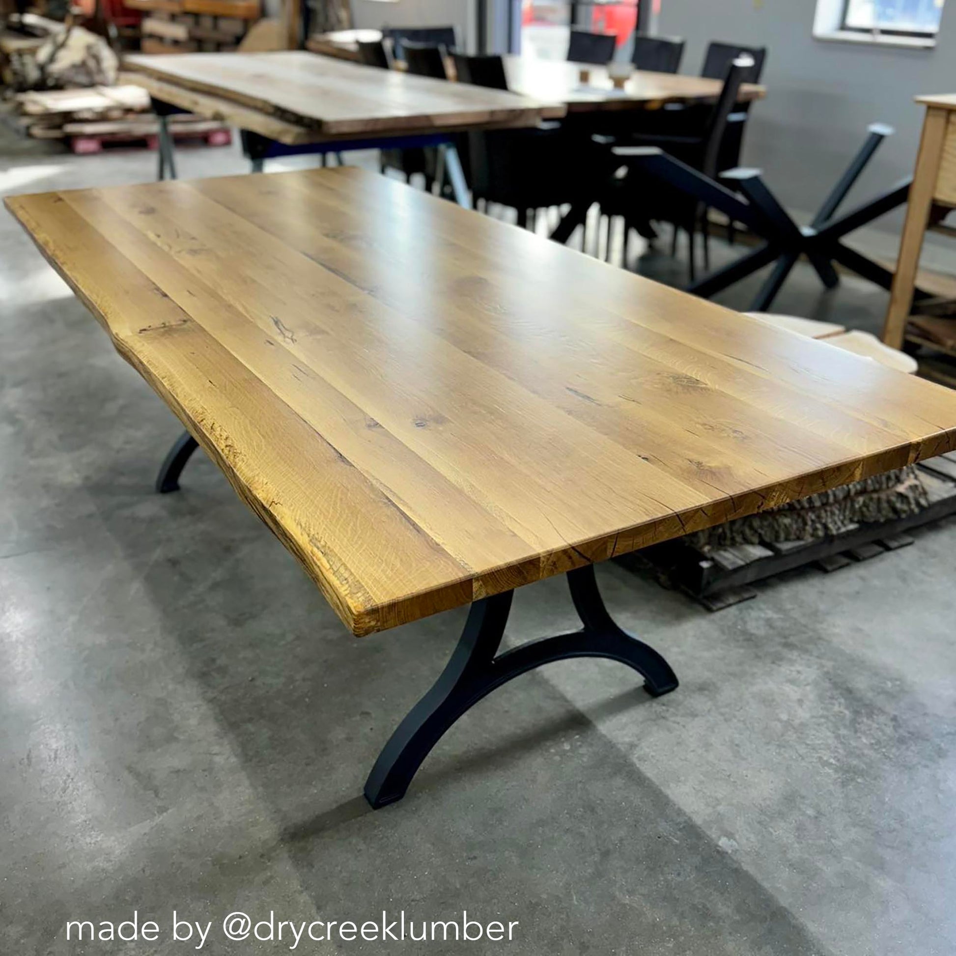 Cast iron dining table legs installed with solid wood tabletop, industrial farmhouse table design