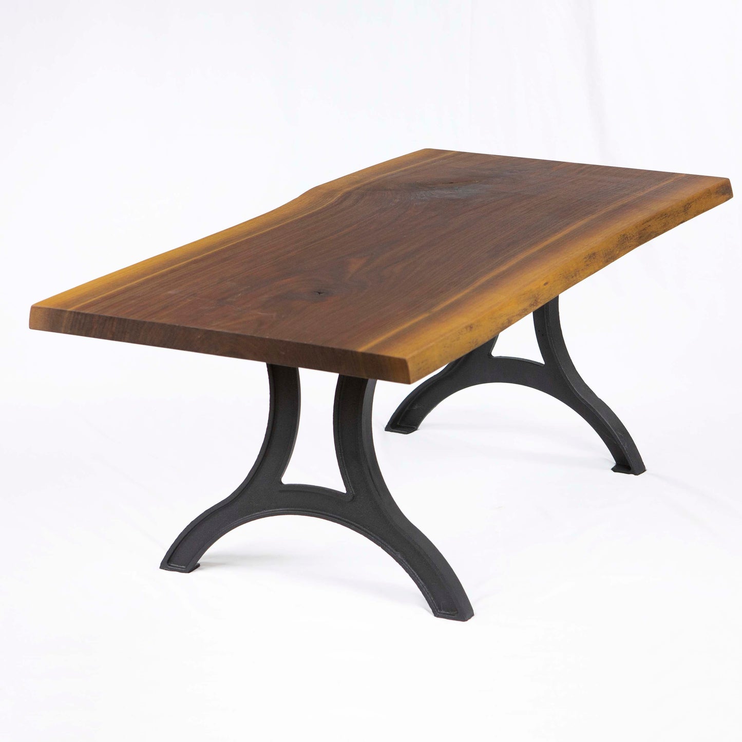 Cast iron coffee table legs installed with solid wood tabletop, rustic industrial coffee table design