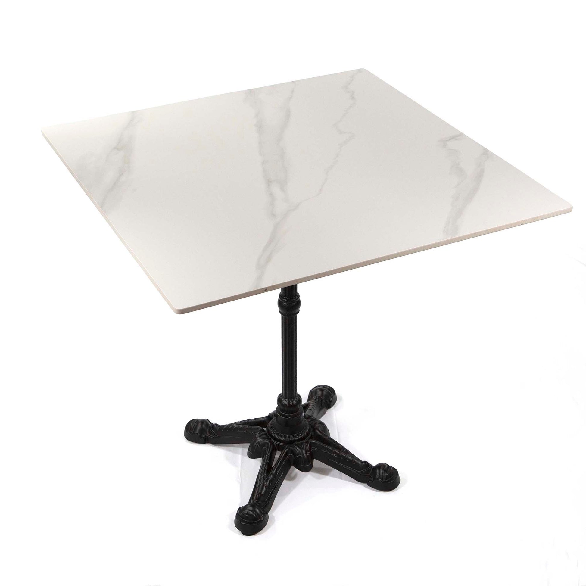 Small table with marble-like top and black metal base on a white background