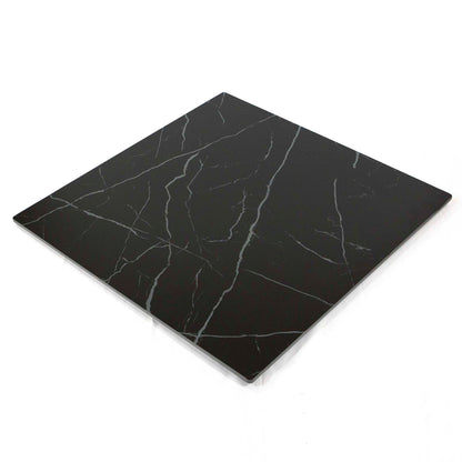 Black marble-patterned cutting board on a white background