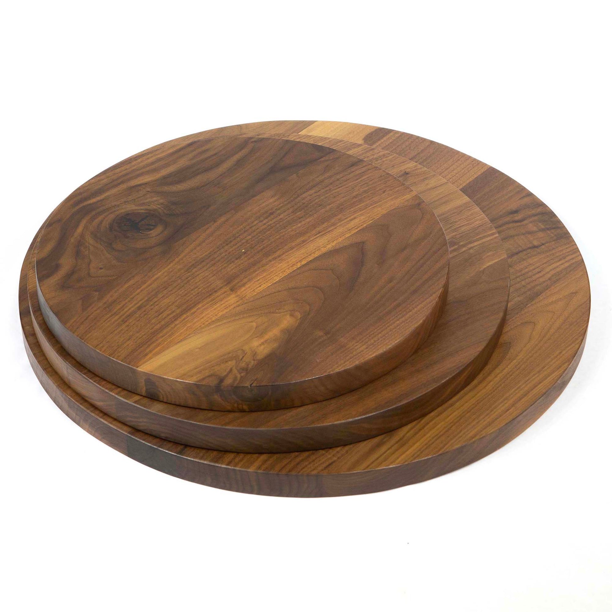 stacked round black walnut tabletops showing multiple size options