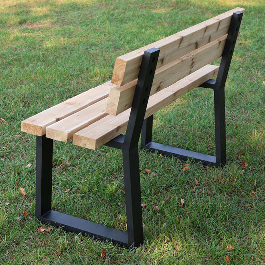 wooden bench supported by black trapezoid aluminum legs with integrated backrest outdoors

